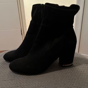 Black and gold heal boots